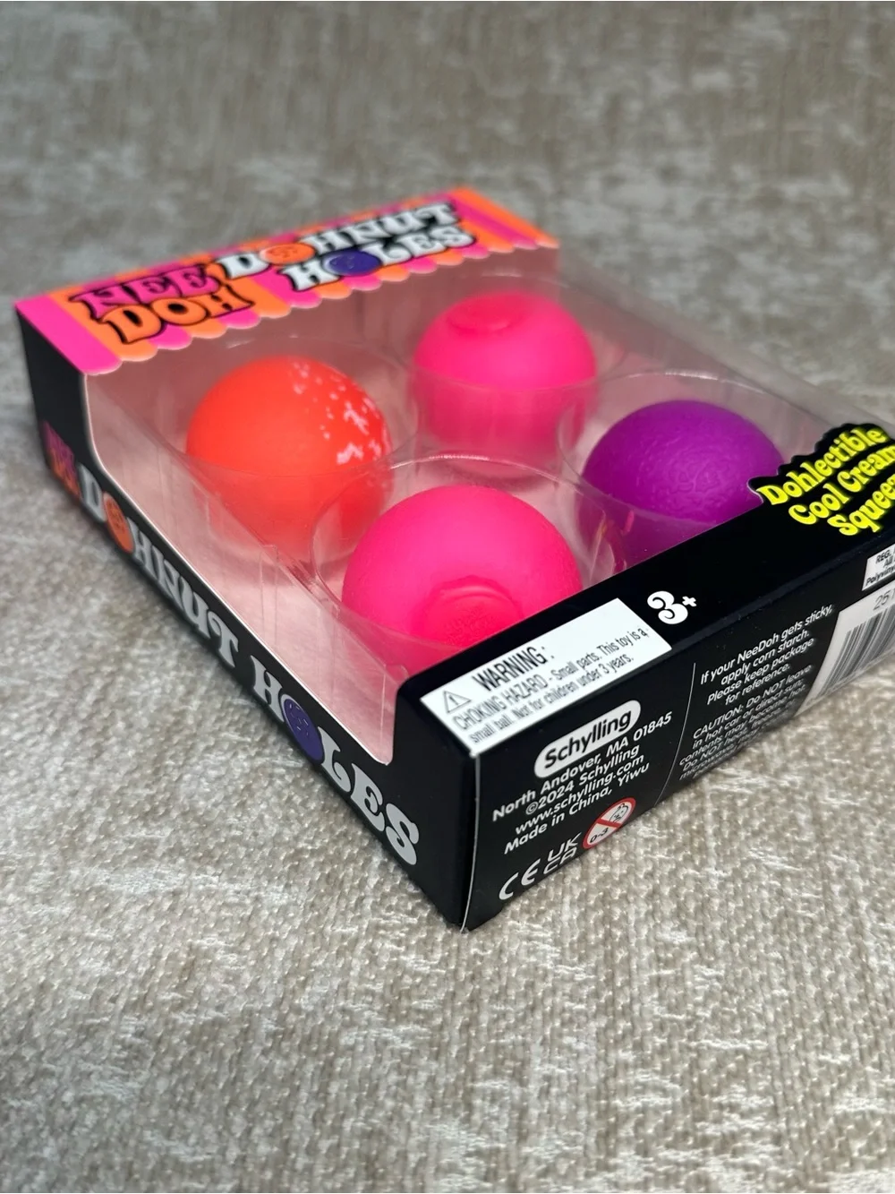 Schylling NeeDoh Donut Holes 4 pack Stress Balls - Pink, Orange & Purple